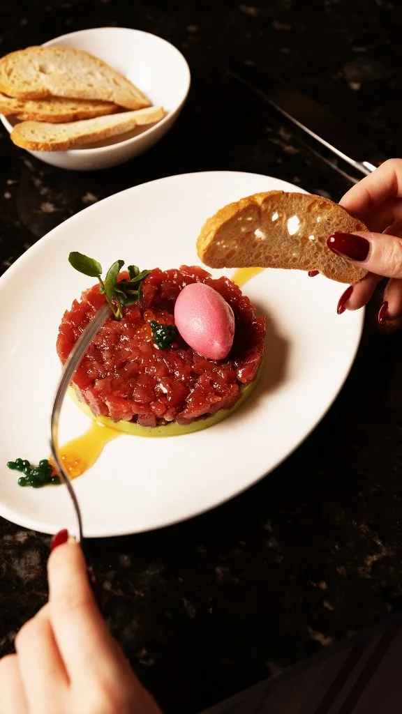 Tuna tartare with avocado, pink sorbet and toasted bread